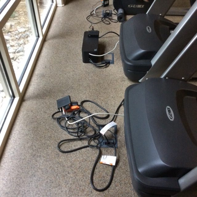 cable box comparison messy cables on floor next to black box of neat cables